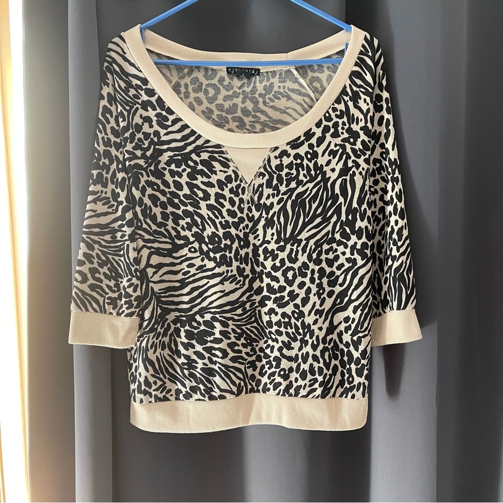 128. Eye Candy leopard pattern sweater. Size L